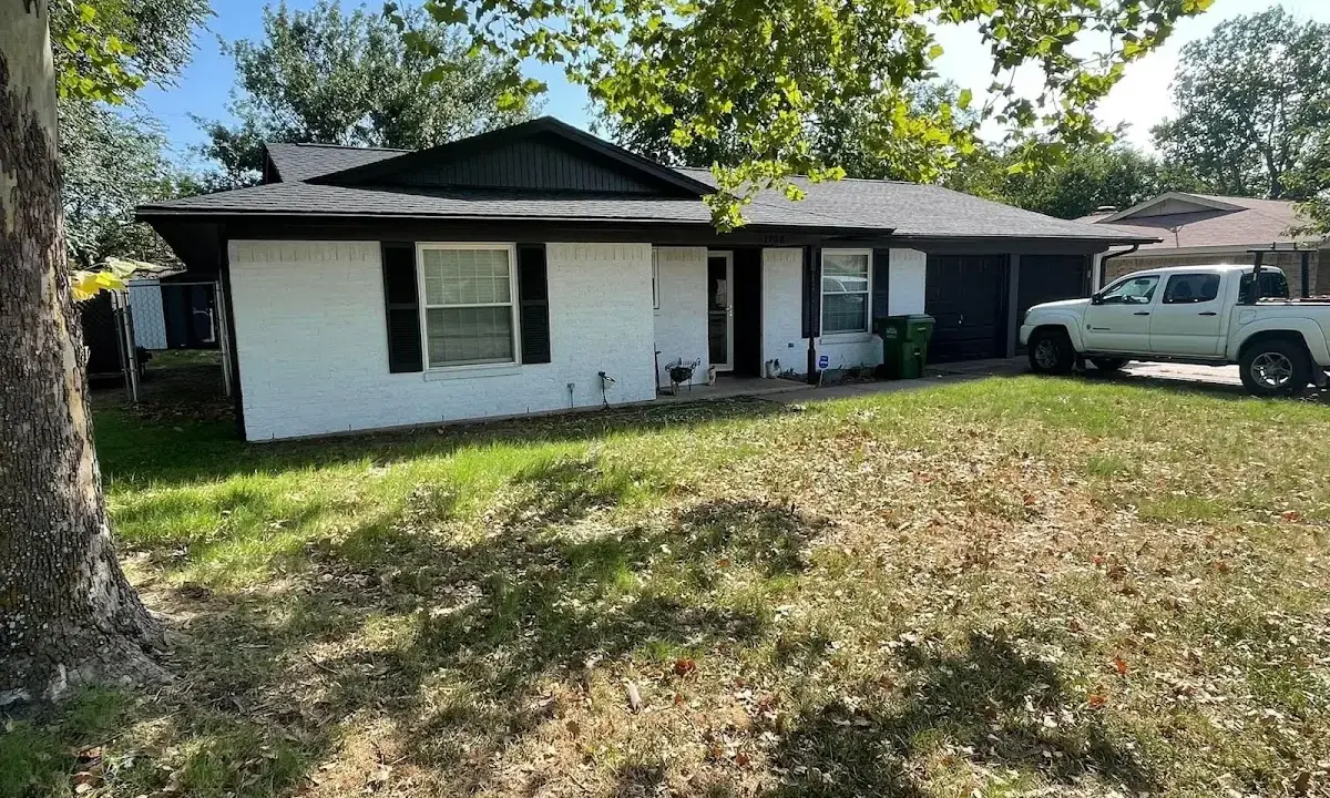 Professional roofing crew working on a residential roof in Midway City